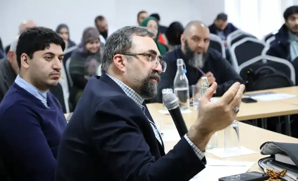 A visiting researcher speaking at an Al-Mahdi Institute seminar, illustrating the vibrant exchange of ideas in critical Islamic scholarship and international visiting fellowships.