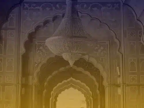 Elegant Islamic interior design with arches and chandelier representing Al Mahdi Institute’s focus on Islamic knowledge, scholarship, and heritage